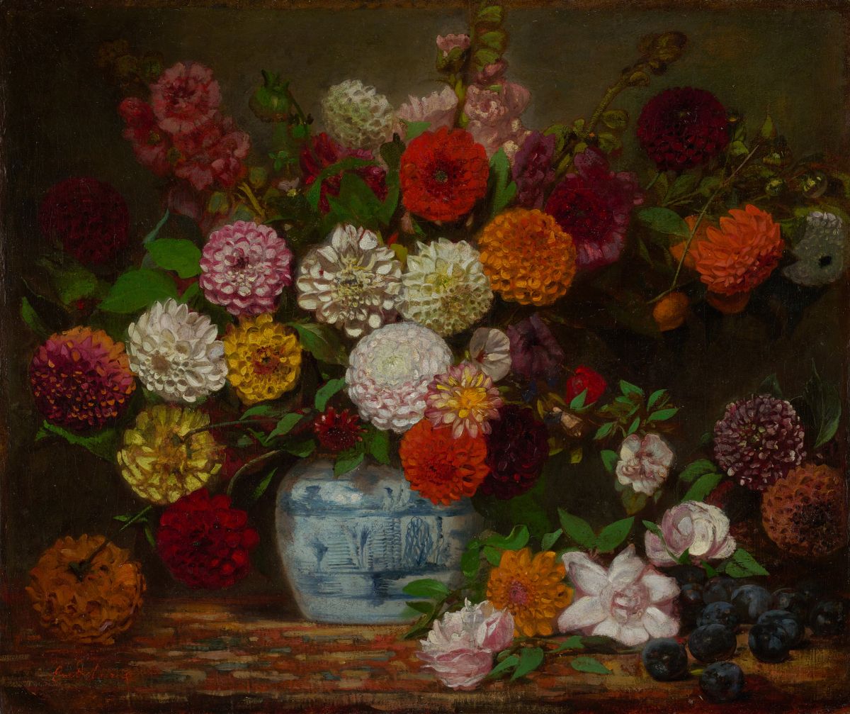 Painting of dahlias, zinnias and hollyhocks in a blue and white vase on a table, surrounded by loose flowers and plums.